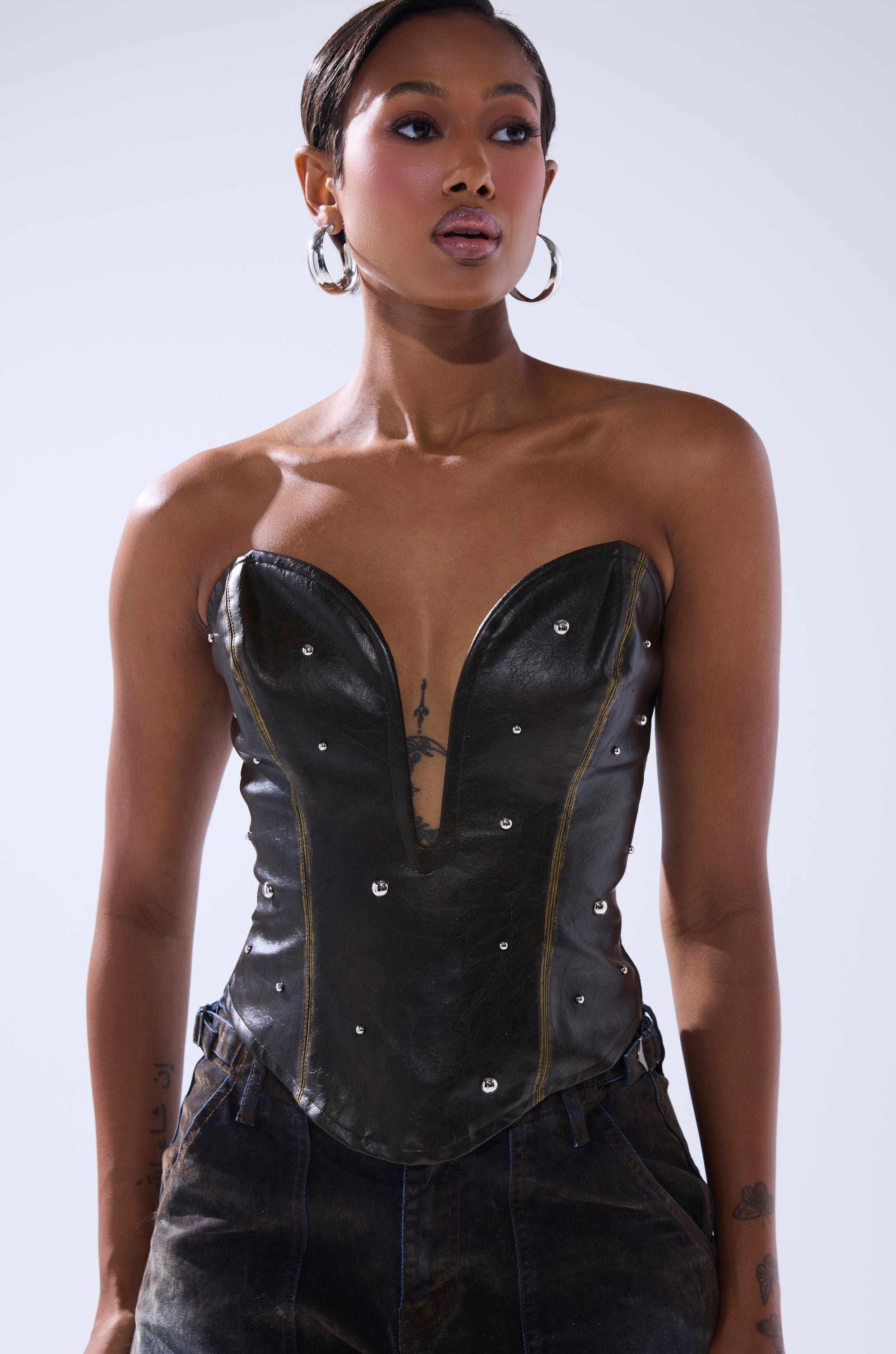 HARD TO PLEASE STUDDED FAUX LEATHER CORSET